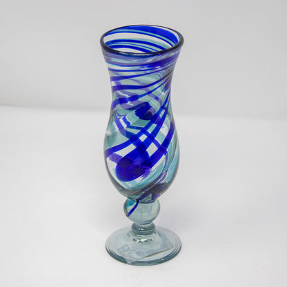 Pina colada glass with a blue swirl design viewed from above