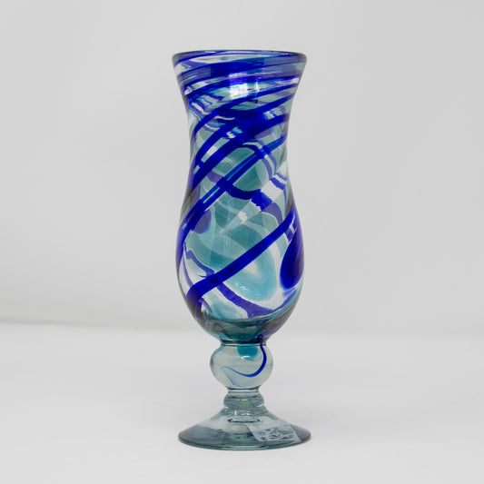 Pina colada glass with blue swirl design front view