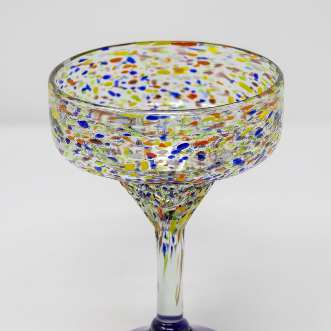 Close up of a margarita glass with confetti rock details